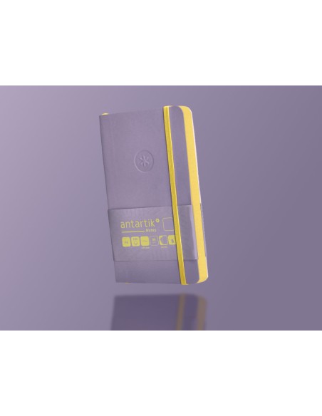 Cuaderno con gomilla antartik notes tapa blanda a6 hojas lisas morado y amarillo 100 hojas 80 gr fsc